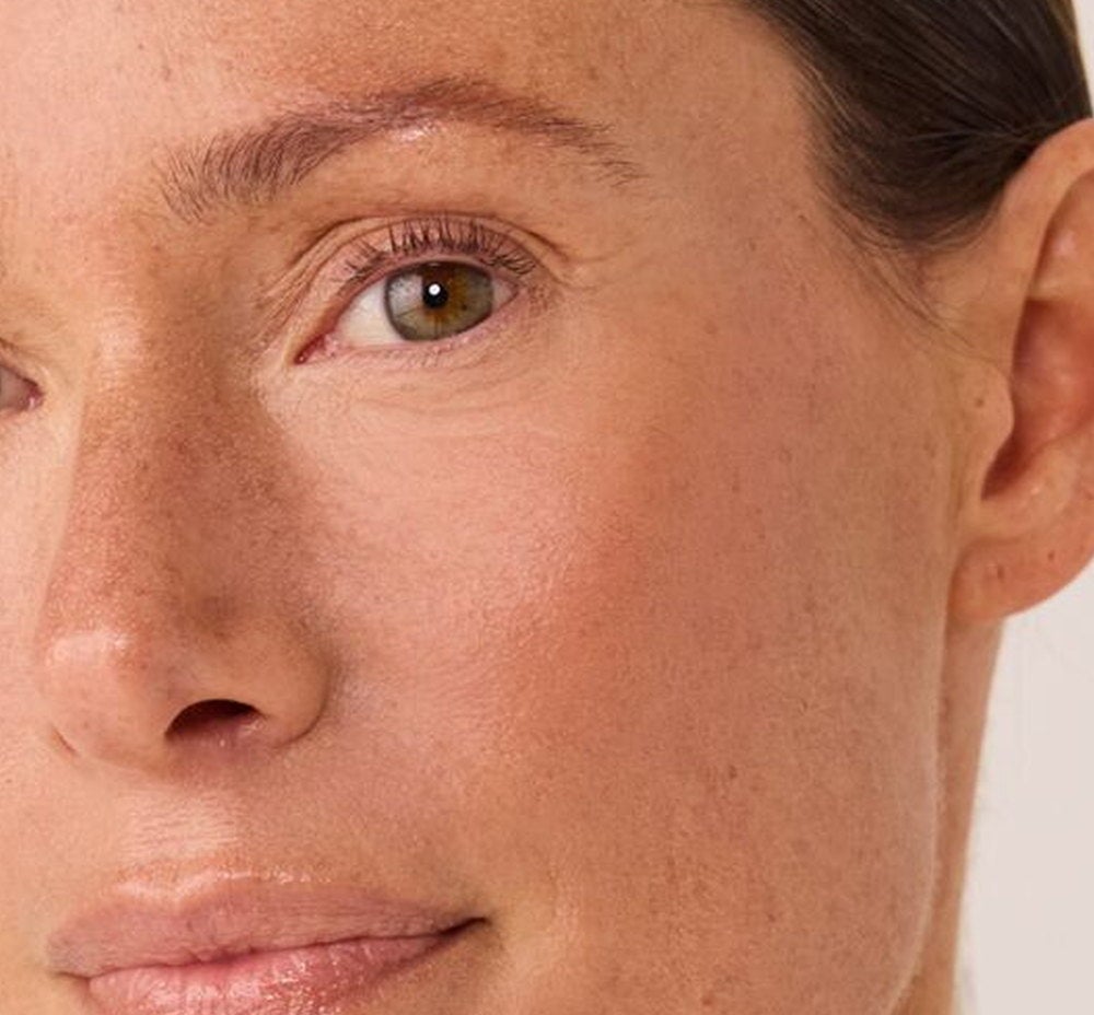 Close-up of a woman’s face with visibly more even-looking skin