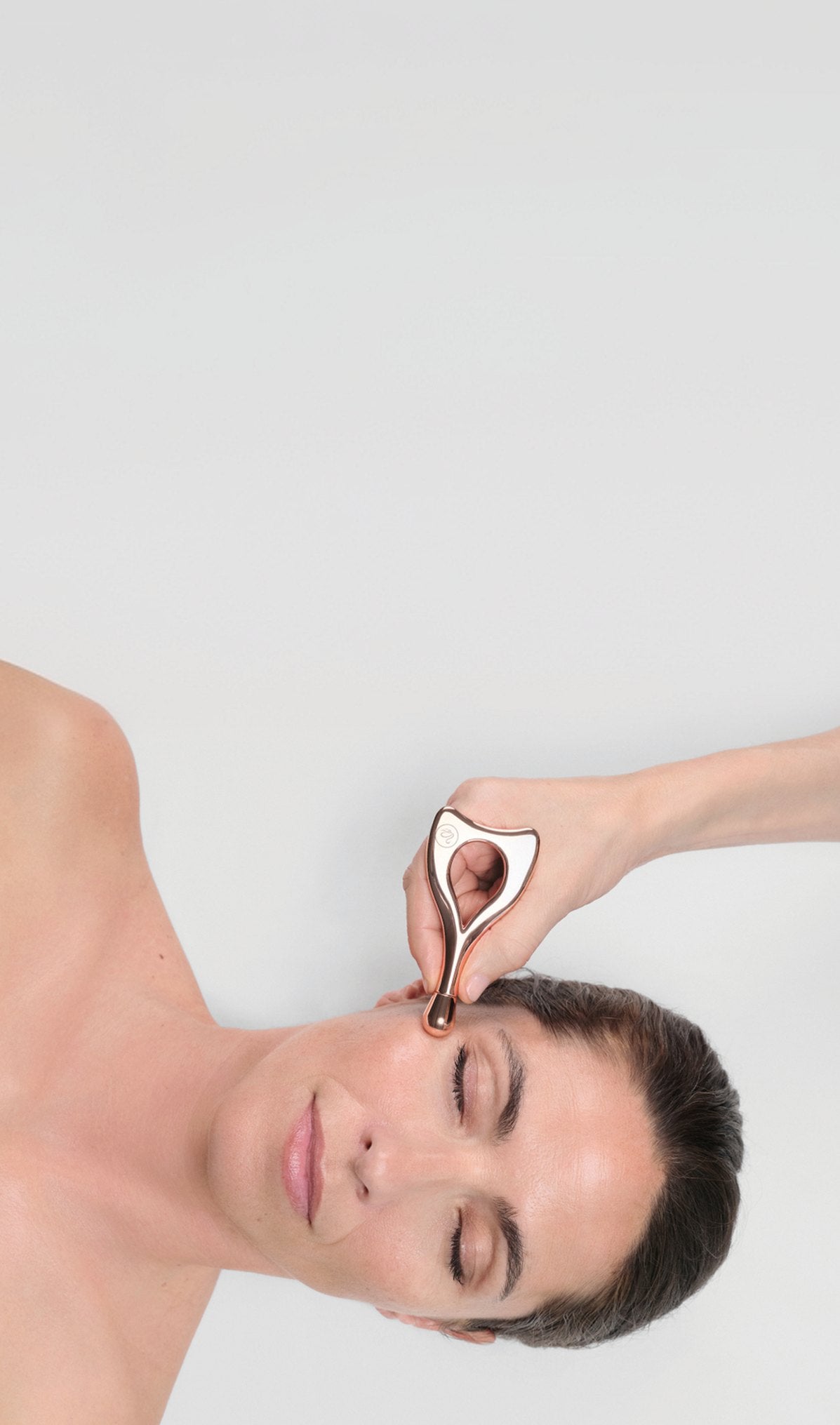 Professional applying the Pro-Collagen Anti-Wrinkle Treatment with the Youth Massager